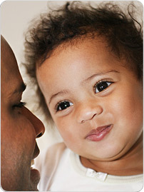 baby smiling at parent