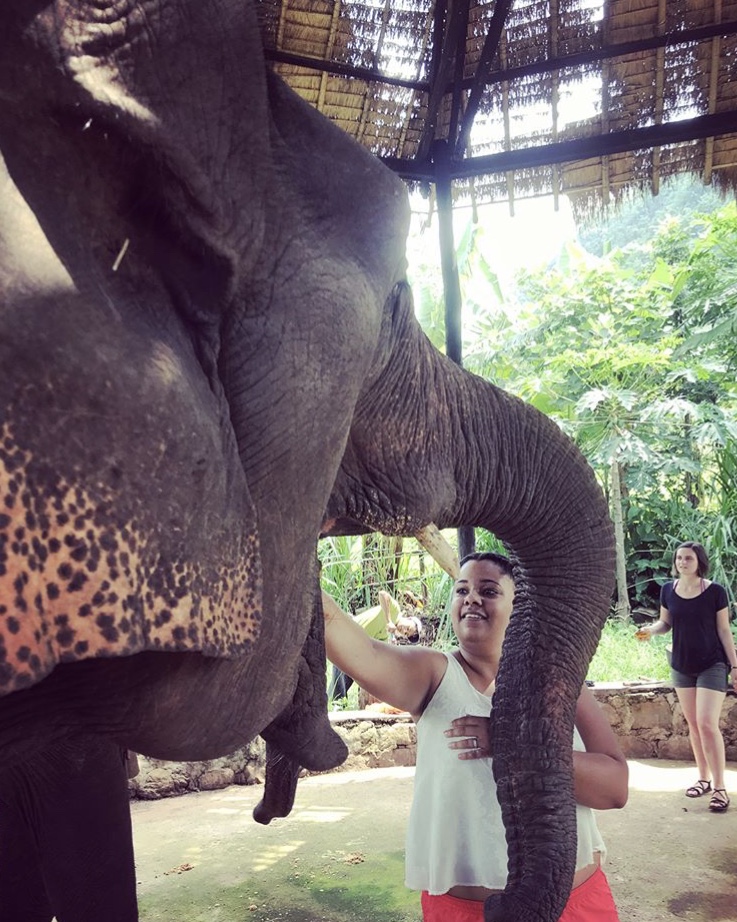 Eva patting an elephant