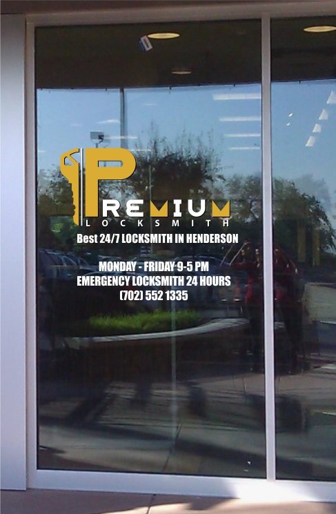 Premium Locksmith logo and phone number (702) 552-1335 on a glass door
