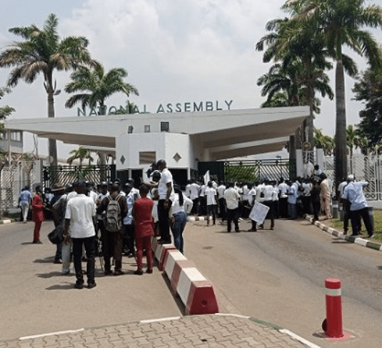 NASS Workers Protest Unpaid Allowances, Arrears, Block NASS Gate