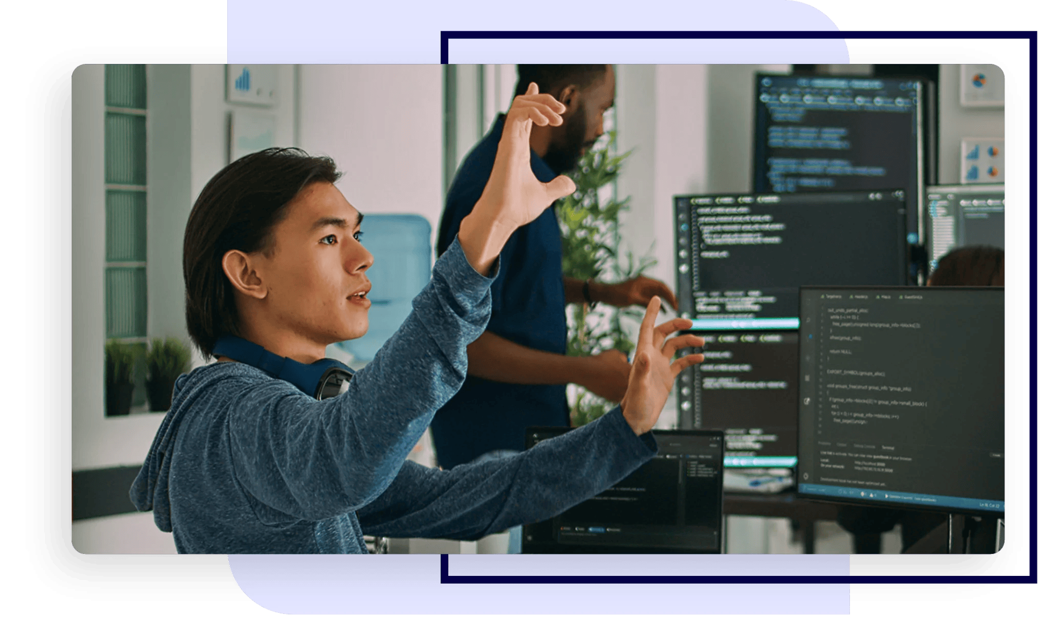 An IT manager working with his team