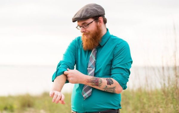 photo of Jeff Matson rolling up his sleeves