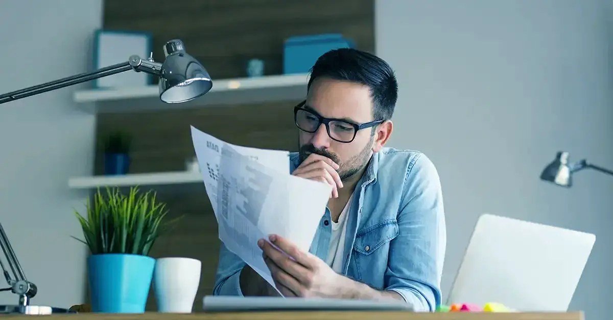 a confuses man looking at his managed WordPress hosting bill