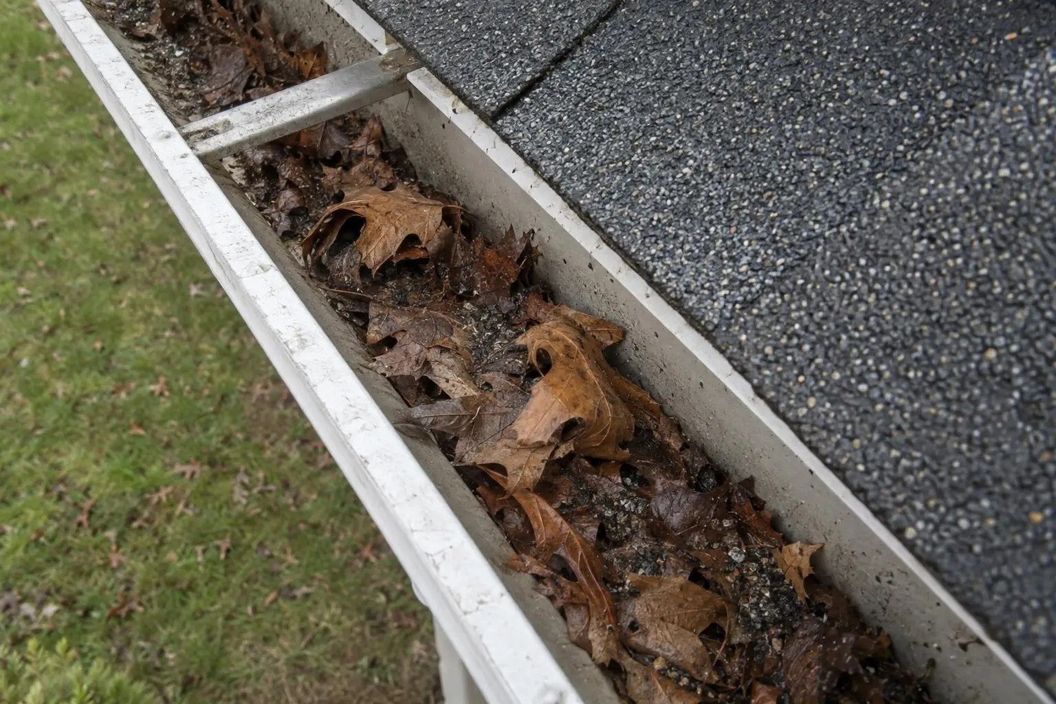 AI-generated illustration: leaves and debris inside a residential gutter.