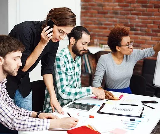 woman on a phone during a small business marketing workshop