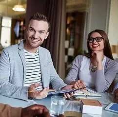 young woman and man discussing strategies during a small business marketing workshop