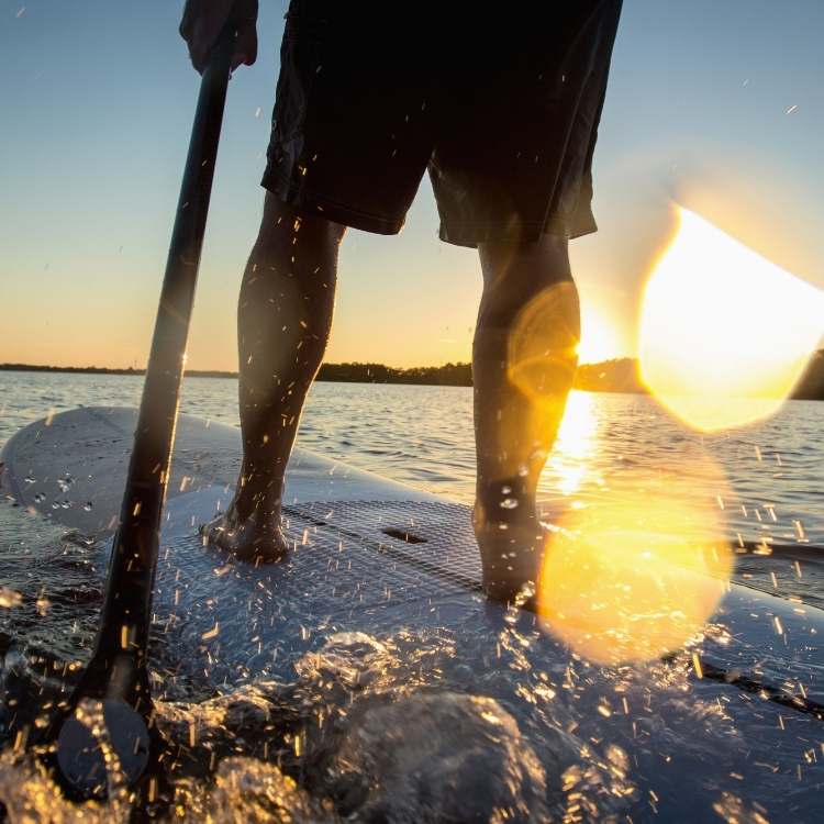 Catching waves on SUP at sunrise