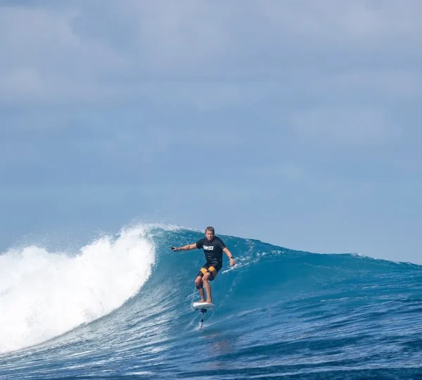 Foil surfing a wave in Bali