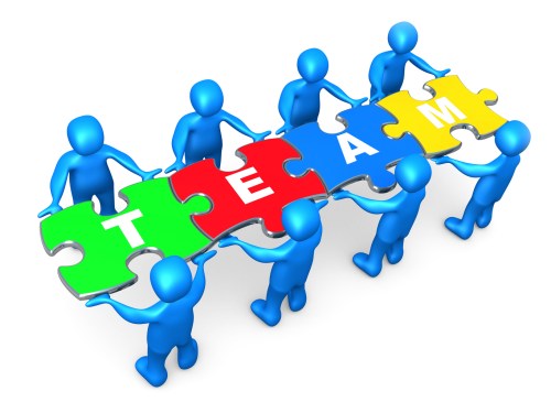 Royalty-free 3d computer generated clipart picture image of a team of 8 blue people holding up connected pieces to a colorful puzzle that spells out "team," symbolizing excellent teamwork, success and link exchanging.