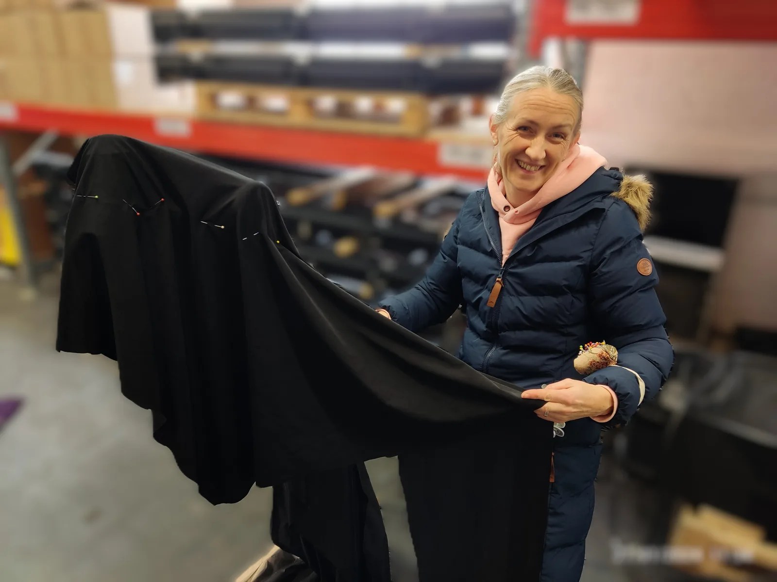 Lucy working on a fitted black cover