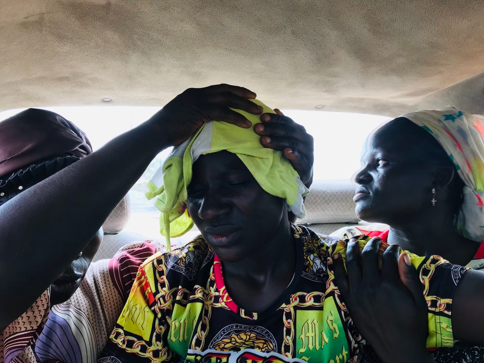 Protestor with head bandage is conveyed by van to a local hospital Monday morning, Aug. 7. Photo by Masara Kim.