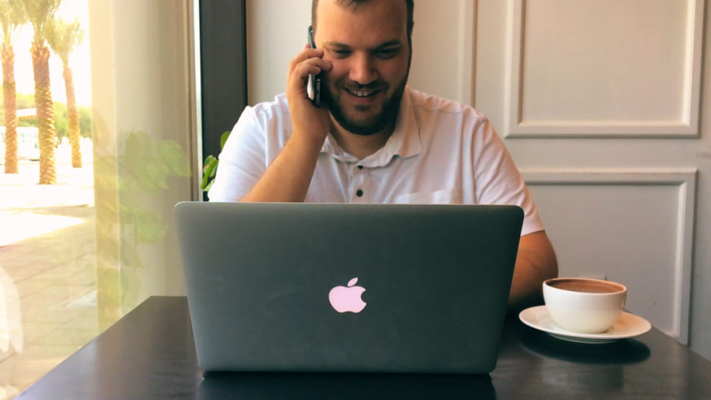 ProEdit writer on the phone with a client