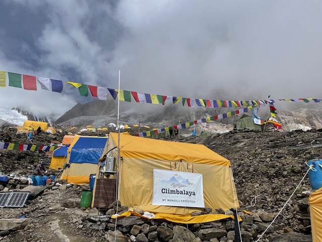 Dining tent and prayer flags after the puja