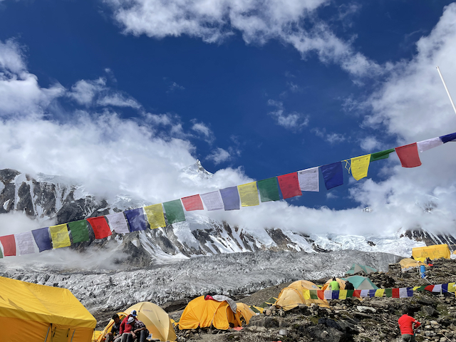 base camp tents with 8000er mountain in background
