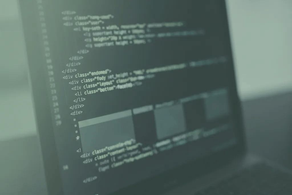 Close-up of website code and layout blocks on a screen