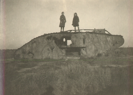 1919 - Ruth Enke and cousin Margy (Enke) Armstrong atop a burned WWI tank.