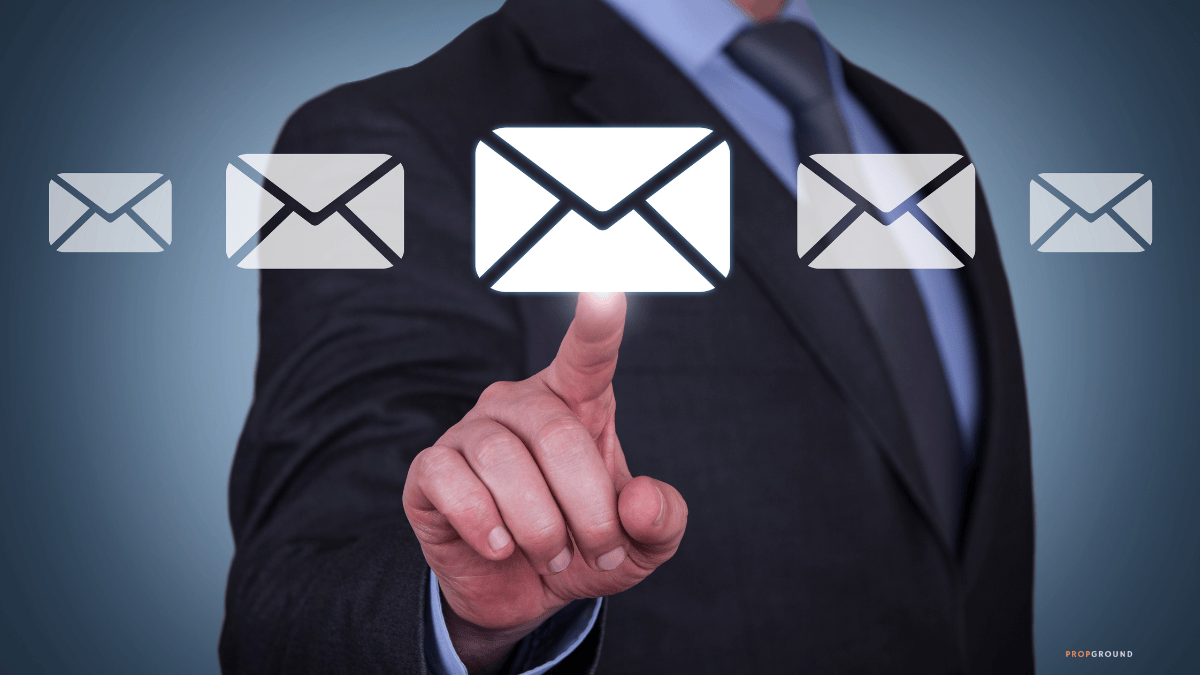 Real estate professional selecting an email icon for digital follow-up and lead communication