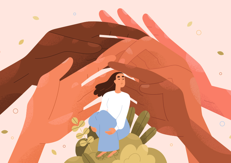 Five hands of different colors supporting a young woman. The young woman is seated on a natural ground.