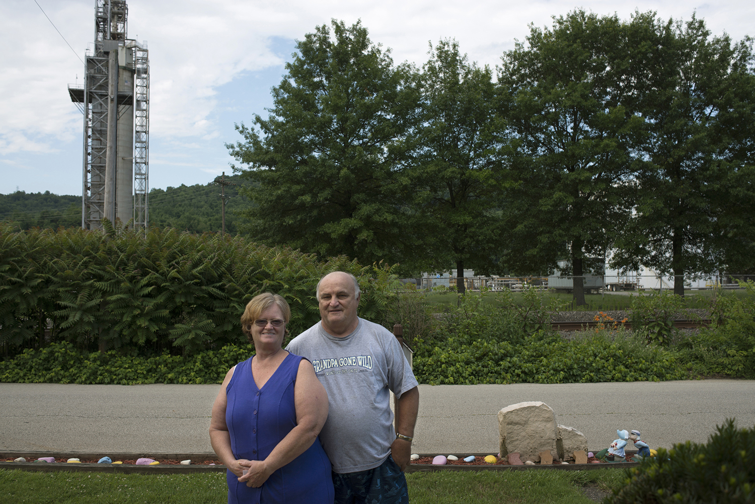 Carl and Evelyn Vehouc in their front yard, which faces the Dyno Nobel plant. The Vehoucs have lived there for 42 years.