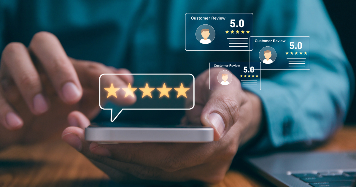 person holding their mobile phone with an overlay of 5 start reviews