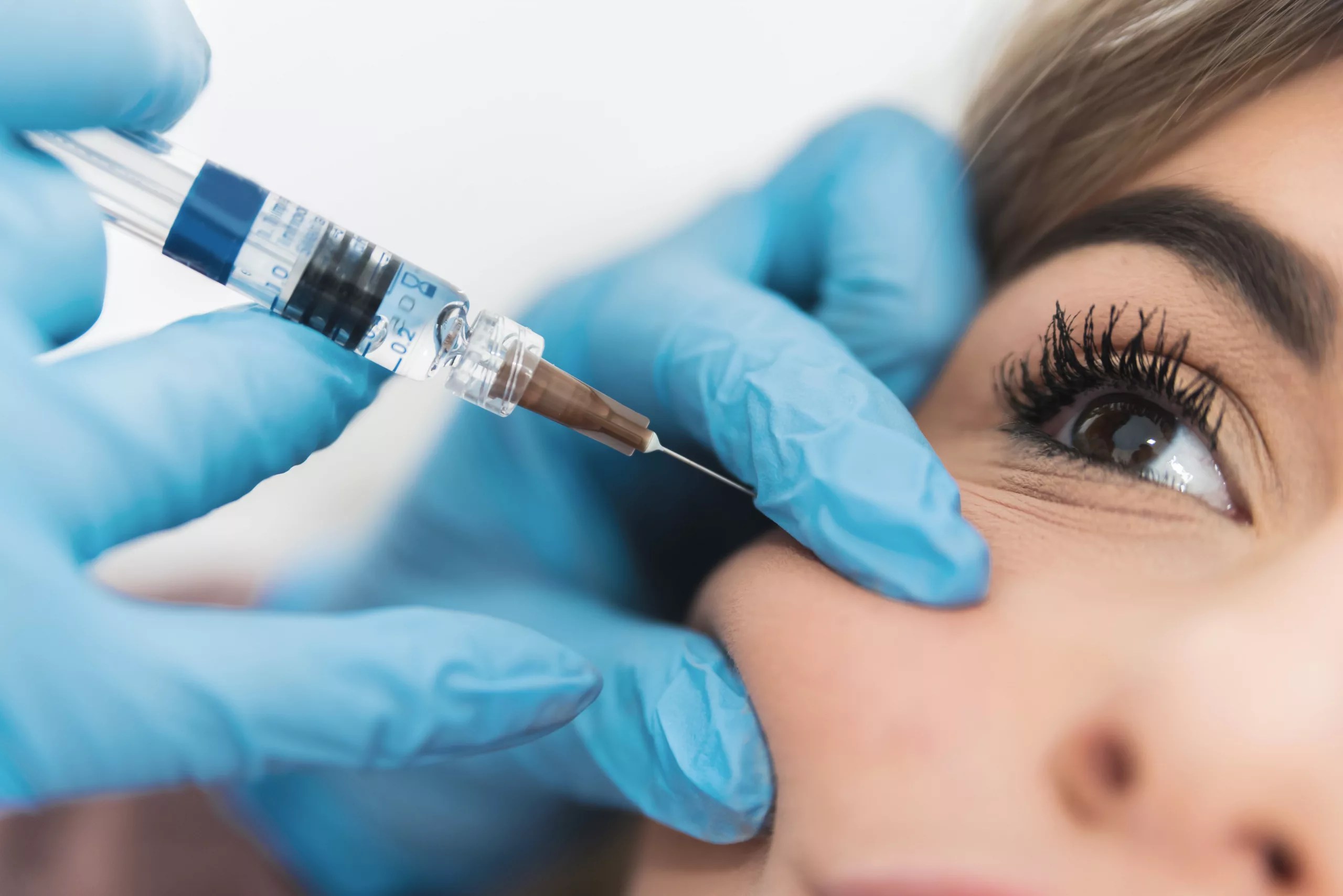 woman getting injectable in cheek