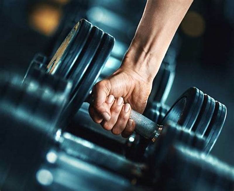 Hand grasping dumbbell