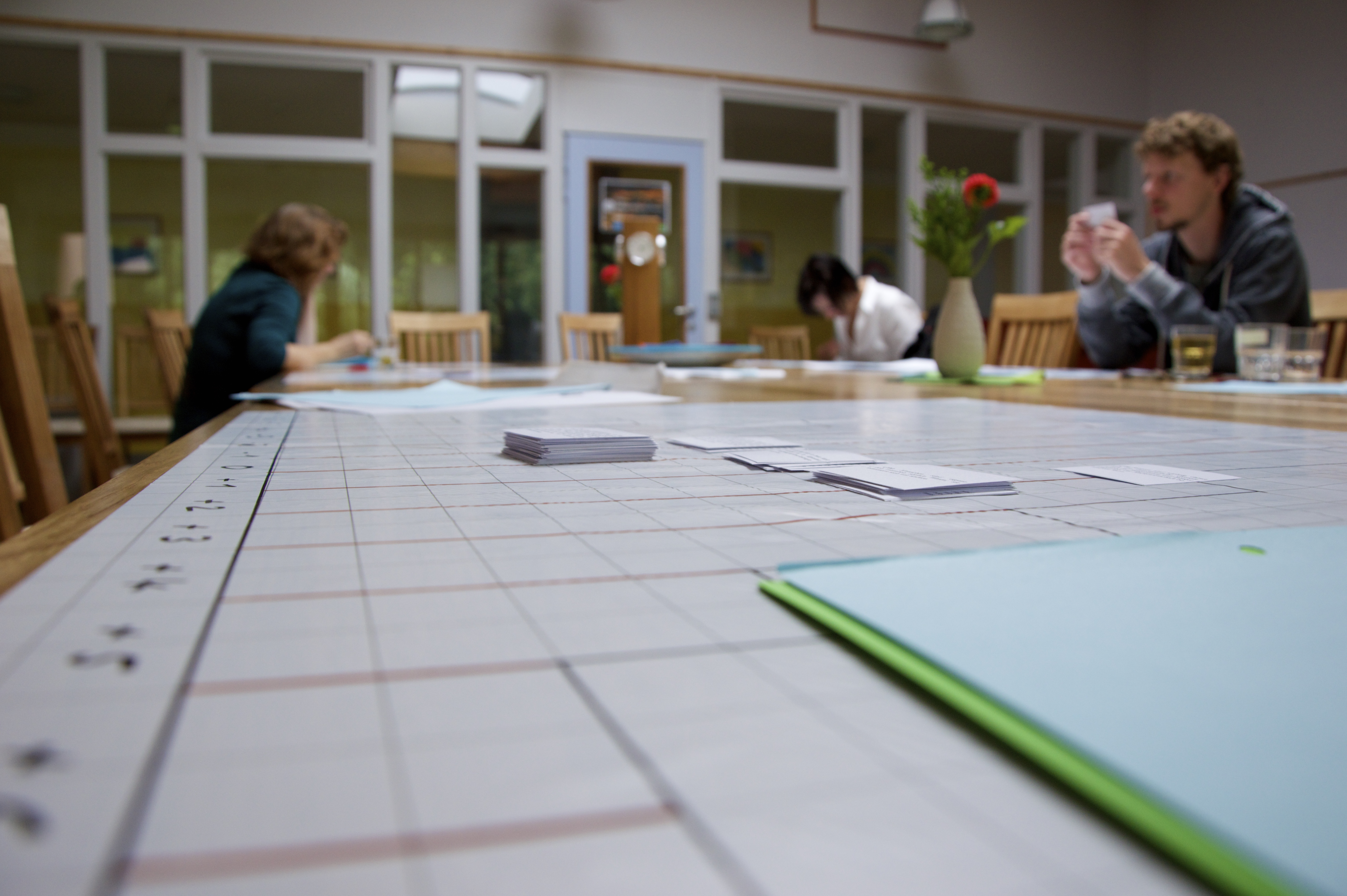 A table with persons doing a Q-sort