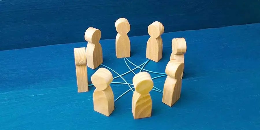 wooden figures connected with string