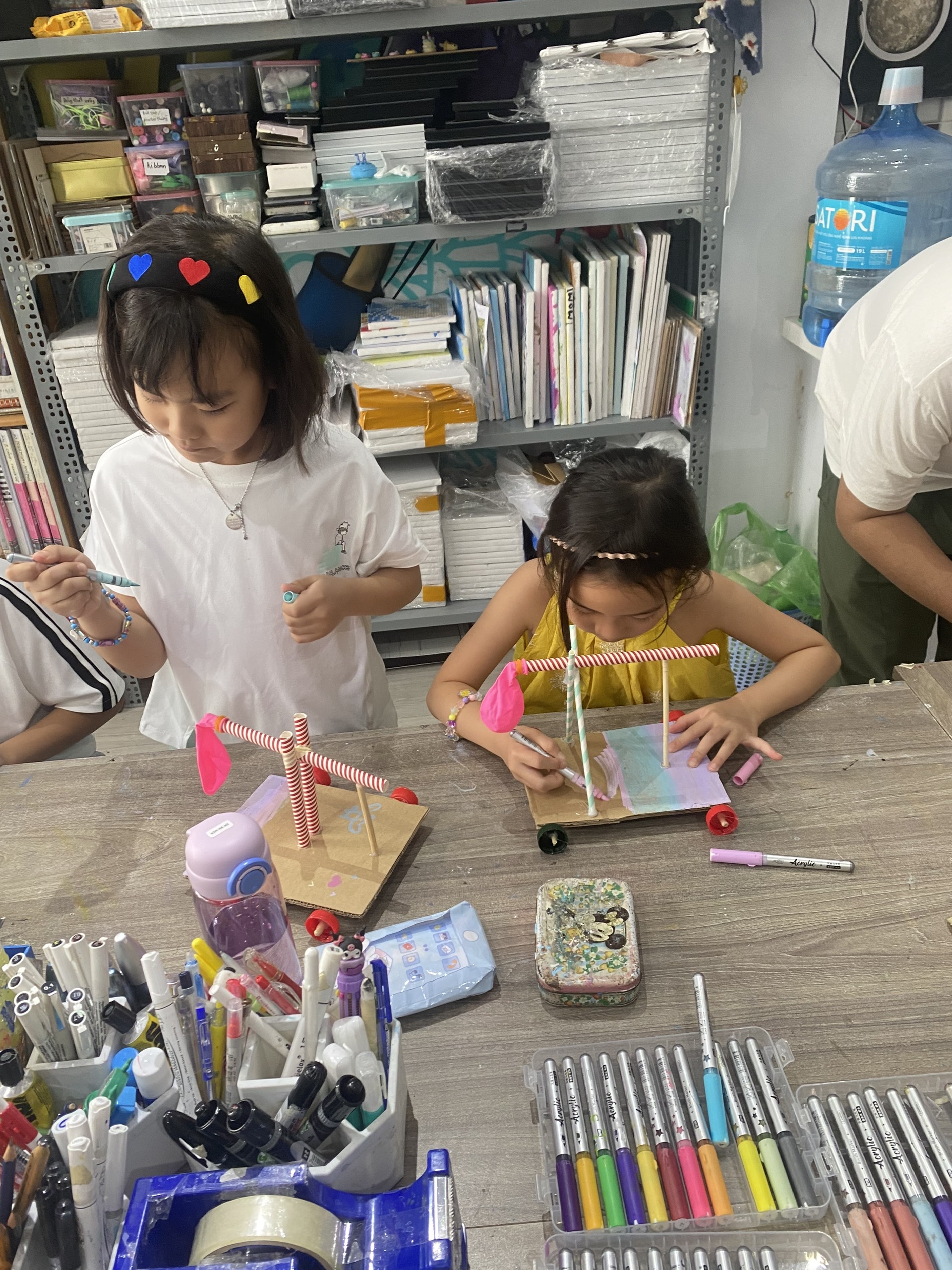 TODO: Young Maker photo — a 5-7 year old using a hand tool or a Makey Makey build