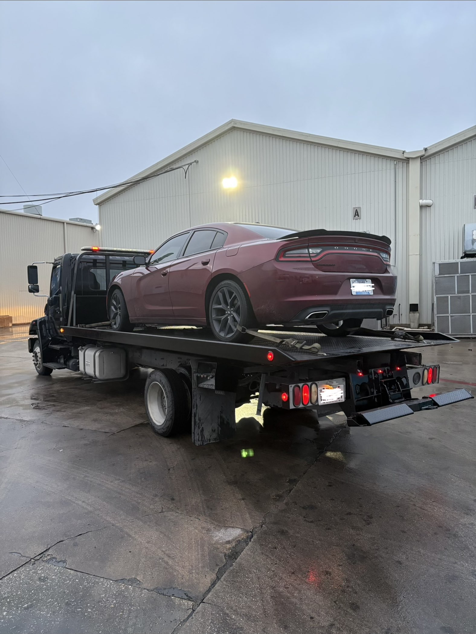 Dodge Charger transported on a QuickStrap Towing flatbed