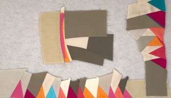 several colourful improv quilt blocks together but not sewn