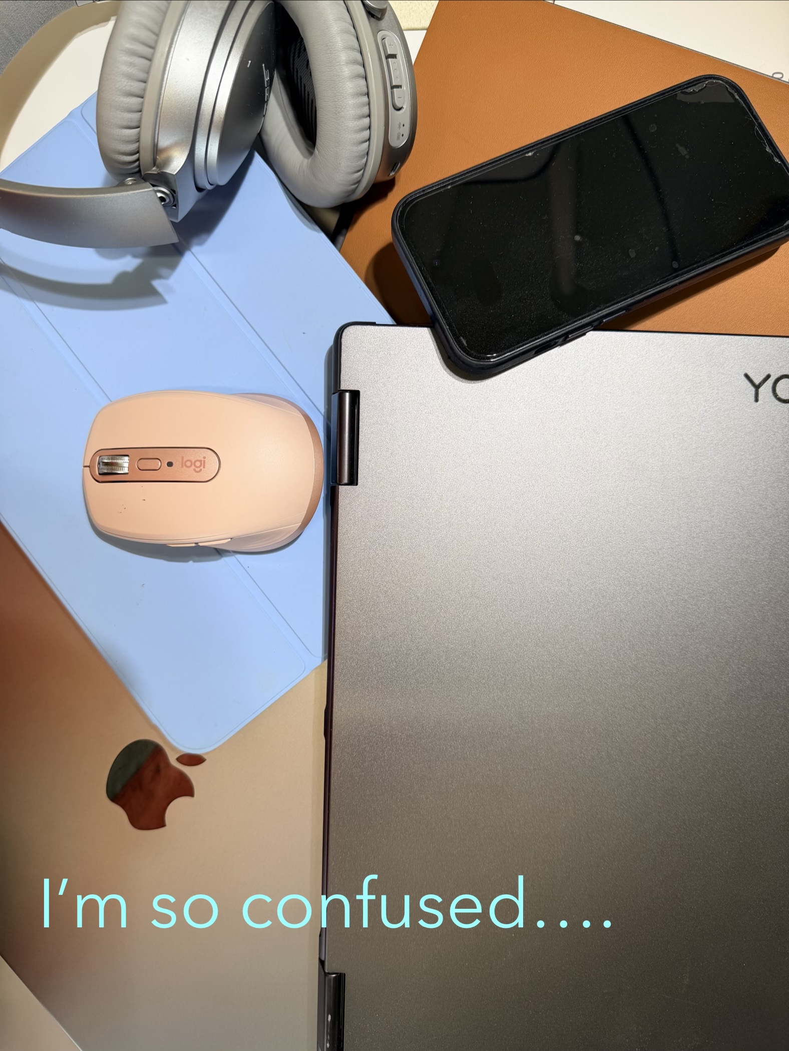 A pile of computers and a comment about feeling confused
