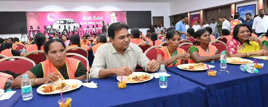 former minister ktr lunch with sanitary workers 