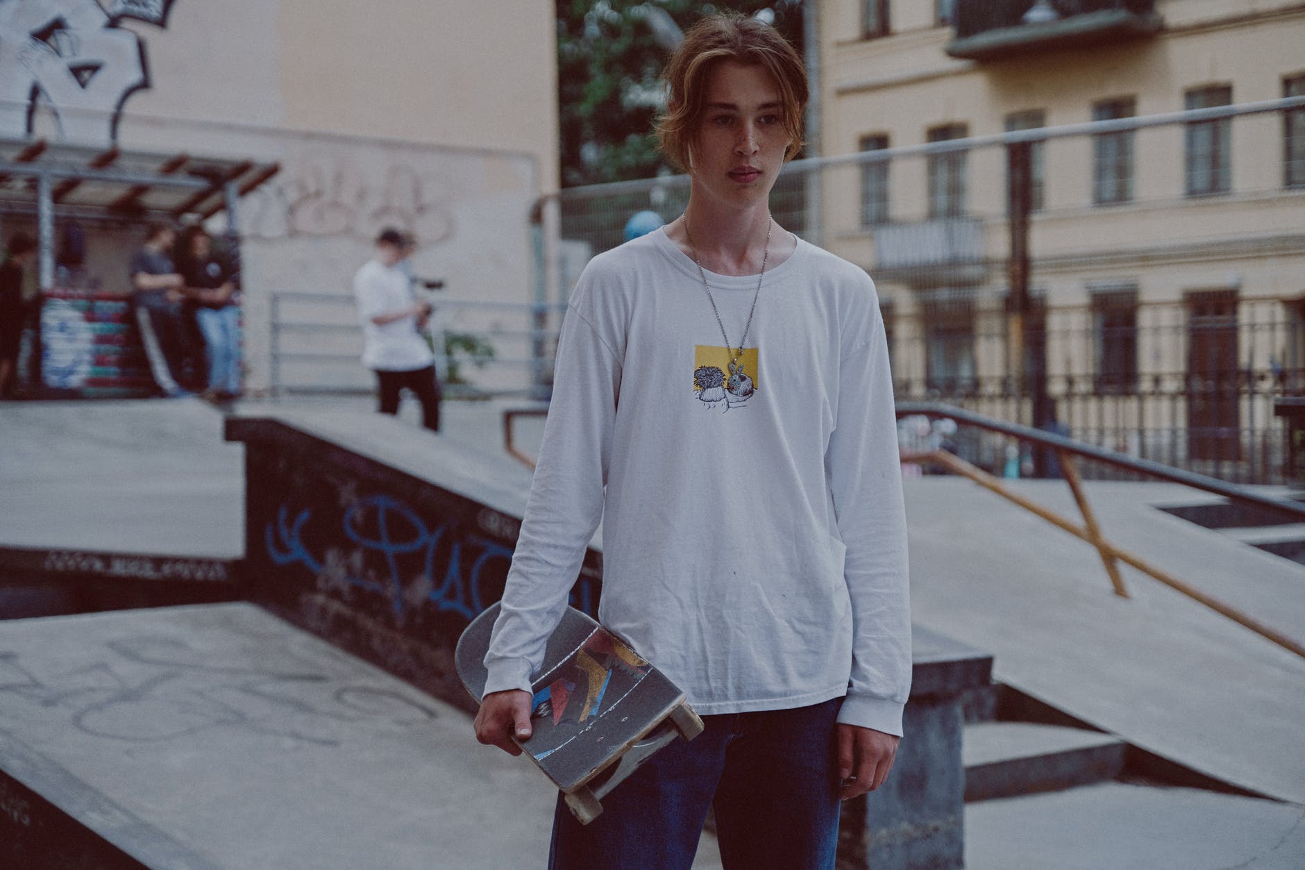 Photo by cottonbro on <a href="https://www.pexels.com/photo/skateboarder-wearing-a-long-sleeves-holding-a-skateboard-5037665/" rel="nofollow">Pexels.com</a>