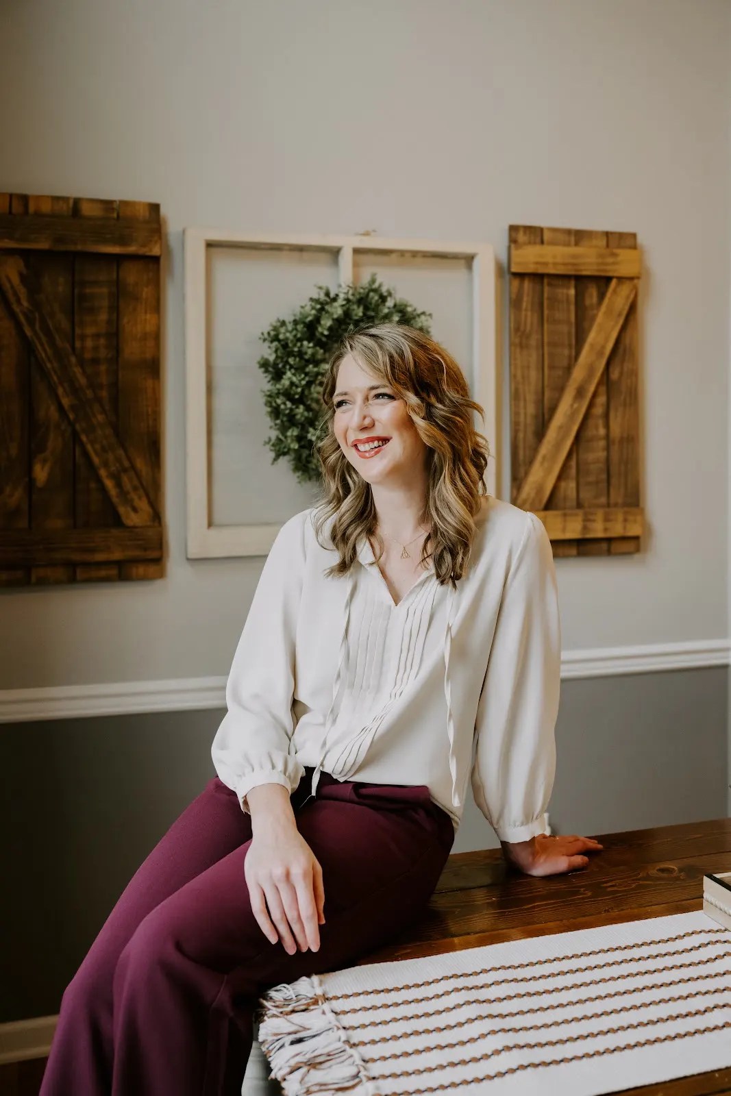 Rachel Ferrell smiling in a thoughtfully styled home interior