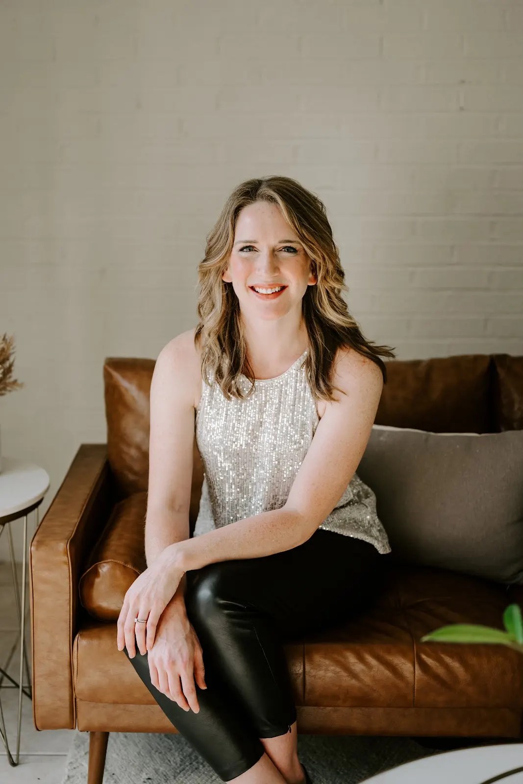 Rachel Ferrell smiling in a modern living room