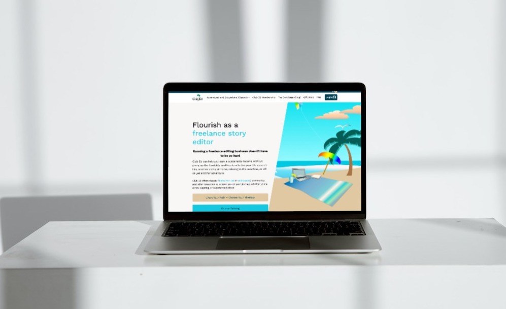 Laptop showing the front page of the club ed website.