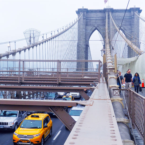Vehicular traffic moves along the lower level.