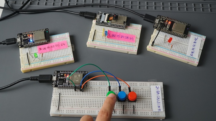 One ESP32 board controls three ESP32 boards via ESP-NOW by pressing a pushbutton for each board