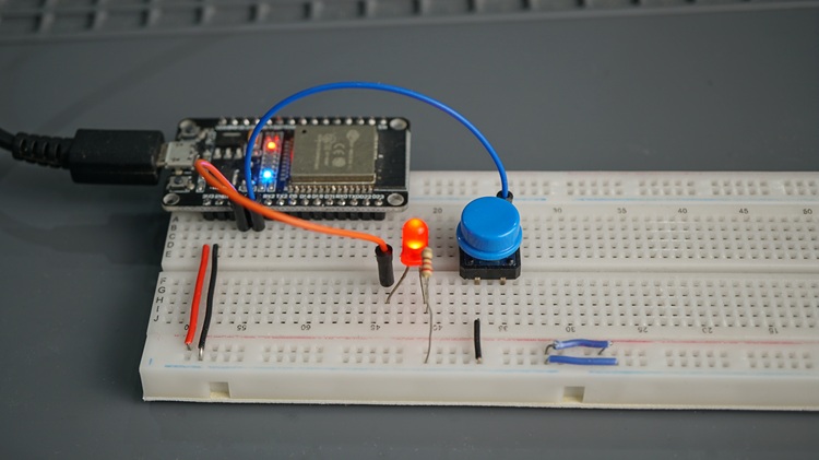 ESP32 connected to an LED and a pushbutton to test FreeRTOS one-shot timers with the ESP32