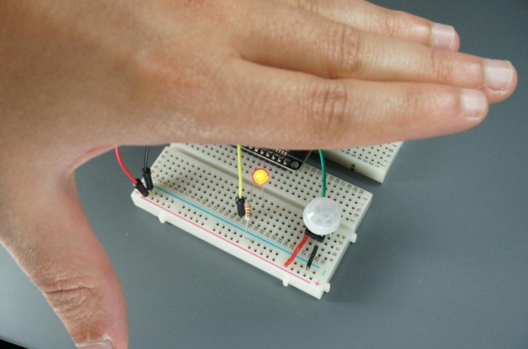 Moving my hand in front of the PIR motion sensor connected to the ESP32