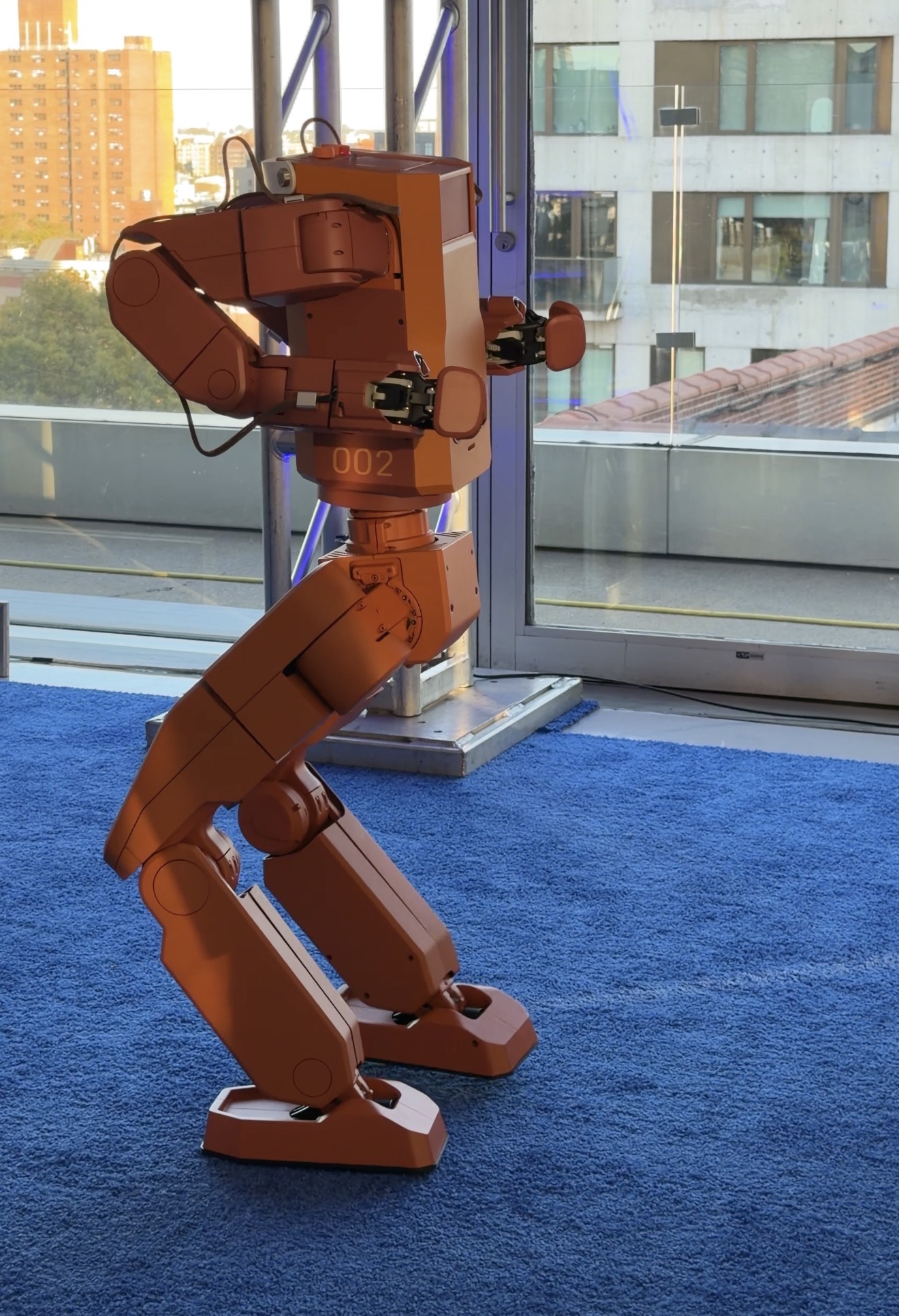 Voxel, the orange Tuesday Labs home robot, at the New Museum launch in NYC