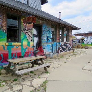 Outdoor Dining Outdoor dining in the arts district beneath creepy murals