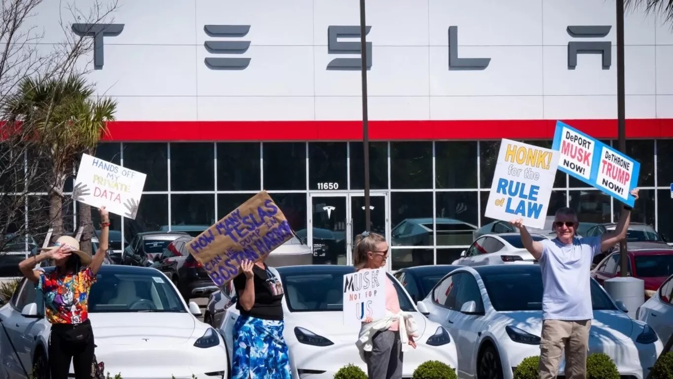 "Tesla Takedown: Protesters Rally Against Elon Musk’s DOGE Role at Showrooms Nationwide"