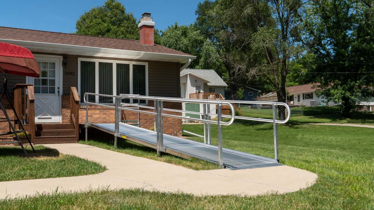 This image shows a modular ramp installed in front of someone's home. This image is here to show that Ray Fisher Pharmacy offers ramps, both modular and standard.
