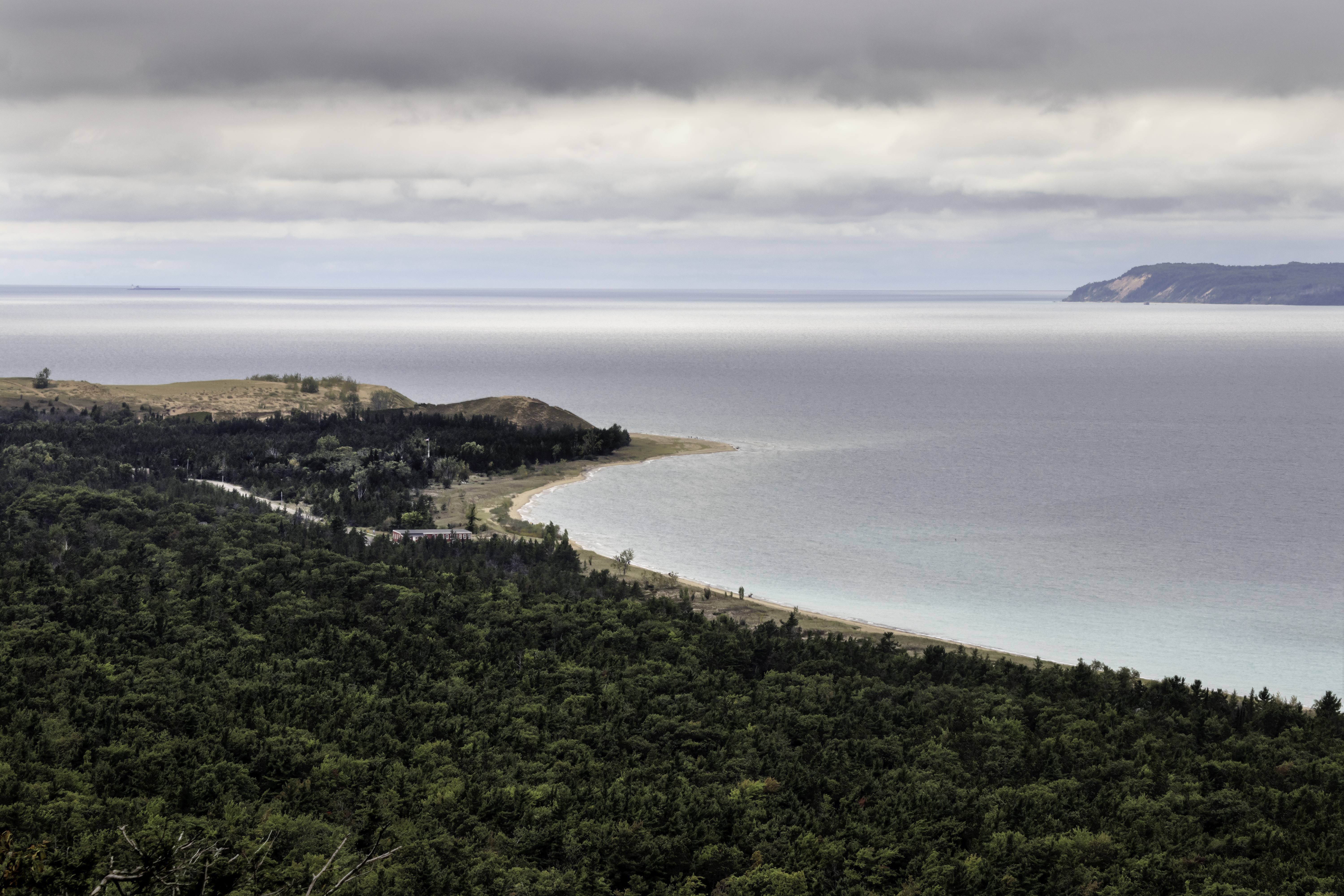 Sleeping Bear Point with South Manitou Island in the distance, as seen from the Islands Overlook on the Alligator HIll Trail at Sleeping Bear National Lakeshore.