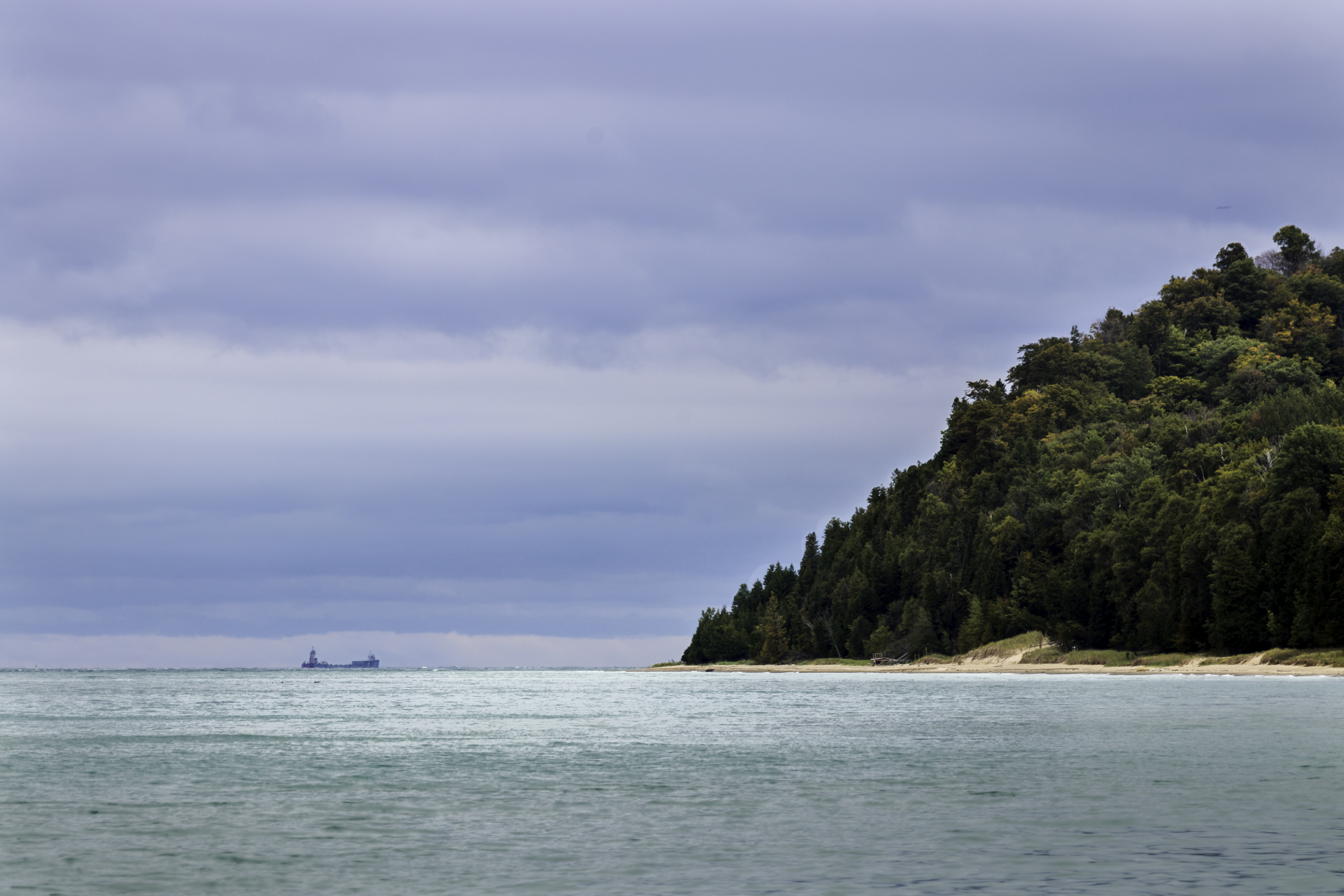 A ship in the distance beyond Pyramid Point, passing through the Manitou Passage