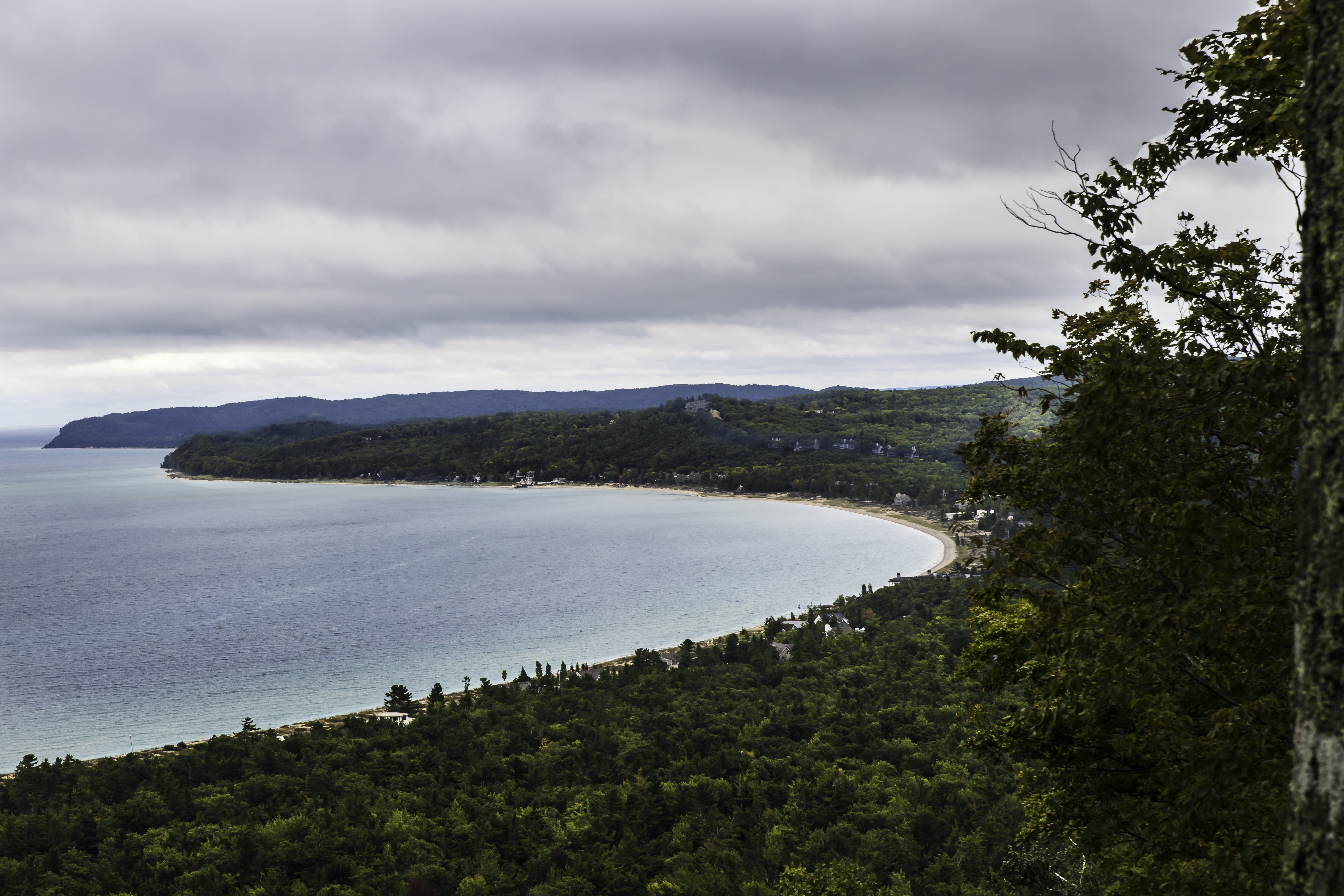 Sleeping Bear Bay with Glen Arbor and the Homestead along the shoreline, as seen from the Islands Overlook on the Alligator HIll Trail at Sleeping Bear National Lakeshore