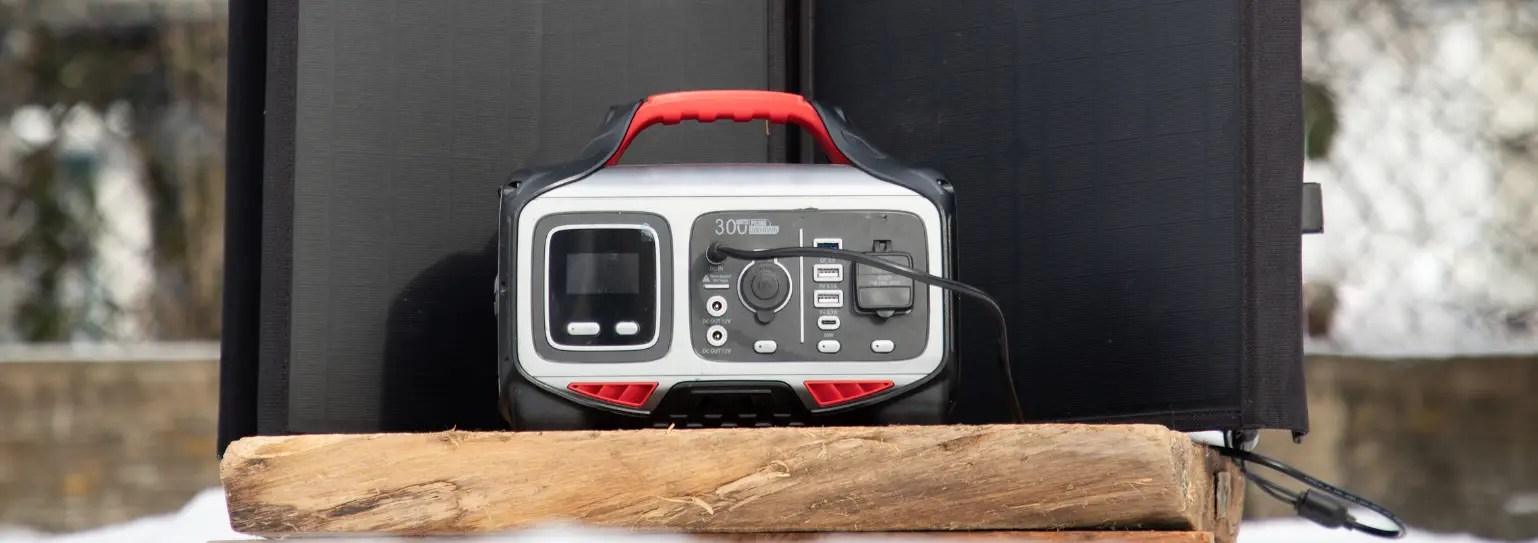Portable solar generator setup with foldable solar panels charging outdoors.