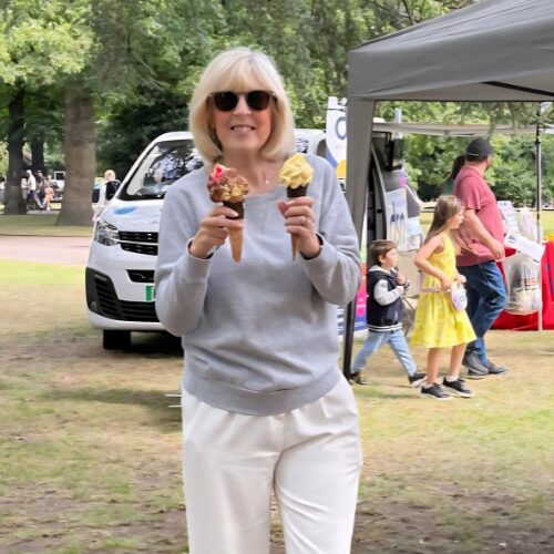 Sue standing in a park with two ice creams